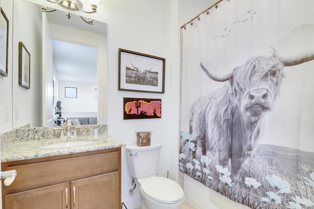 bathroom with a shower with curtain, vanity, and toilet