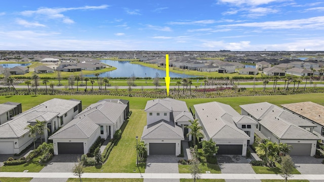 aerial view with a water view and a residential view