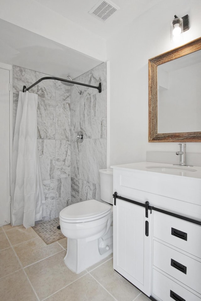 bathroom featuring visible vents, toilet, tile patterned floors, vanity, and a shower stall