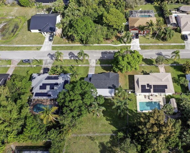 birds eye view of property with a residential view