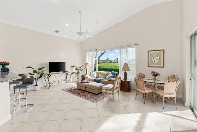 living area featuring baseboards, a ceiling fan, crown molding, high vaulted ceiling, and light tile patterned flooring