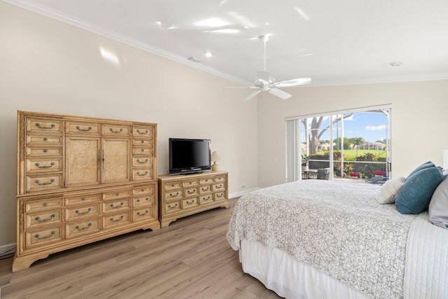 bedroom with access to exterior, lofted ceiling, ornamental molding, a ceiling fan, and wood finished floors