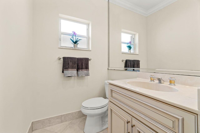 half bath featuring toilet, ornamental molding, vanity, tile patterned flooring, and baseboards