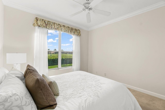 bedroom featuring ornamental molding, light carpet, ceiling fan, and baseboards