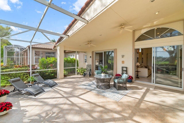 unfurnished sunroom with a wealth of natural light and ceiling fan