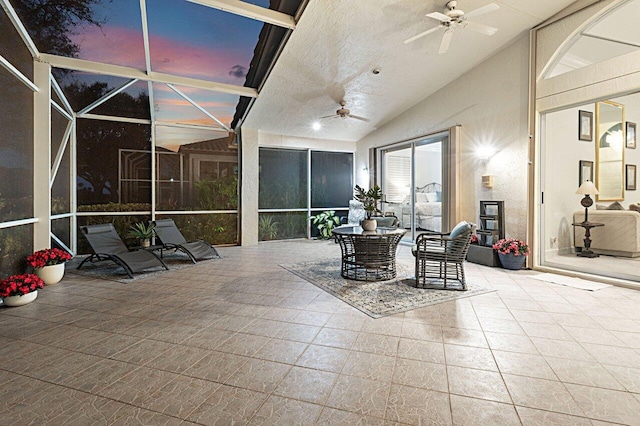 sunroom / solarium with vaulted ceiling and ceiling fan