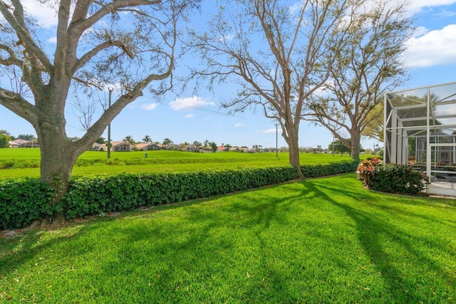 view of yard featuring a lanai