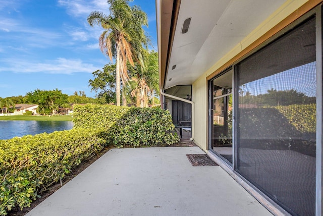 view of patio with a water view