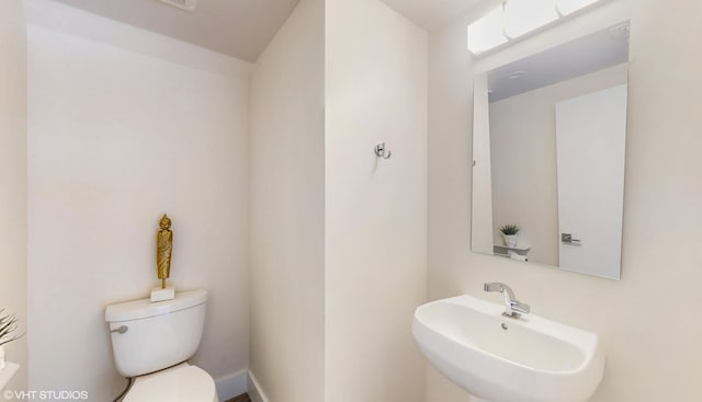 bathroom with a sink and toilet