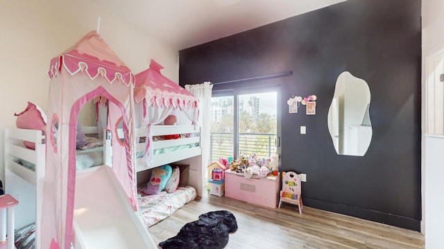 bedroom featuring wood finished floors