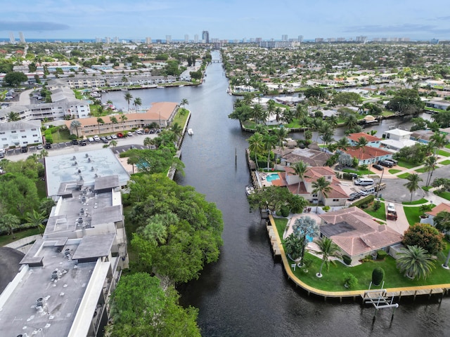 bird's eye view featuring a water view and a city view