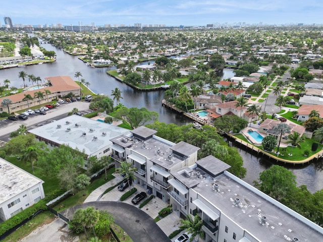 drone / aerial view with a view of city and a water view