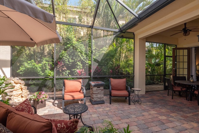 sunroom with a ceiling fan