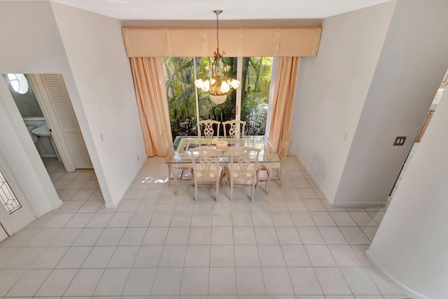 unfurnished dining area with light tile patterned flooring and an inviting chandelier