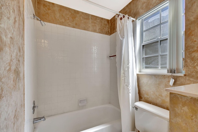 full bathroom with toilet, wallpapered walls, and shower / bathtub combination with curtain