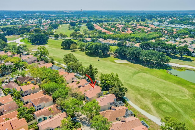 bird's eye view with view of golf course, a water view, and a residential view