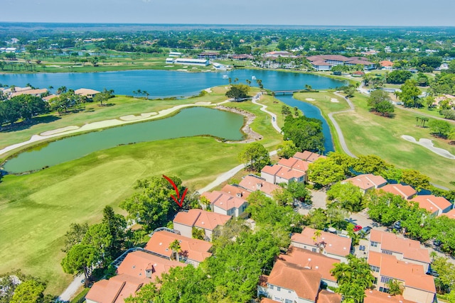 birds eye view of property with a water view, a residential view, and golf course view