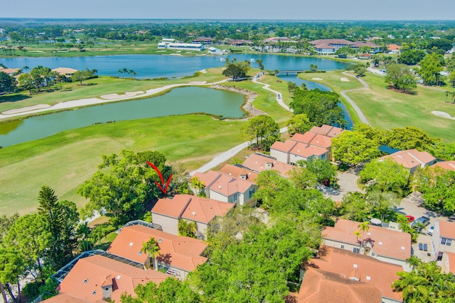 birds eye view of property with a residential view, view of golf course, and a water view