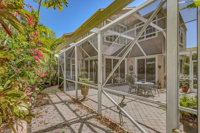 view of home's exterior with a lanai and a patio