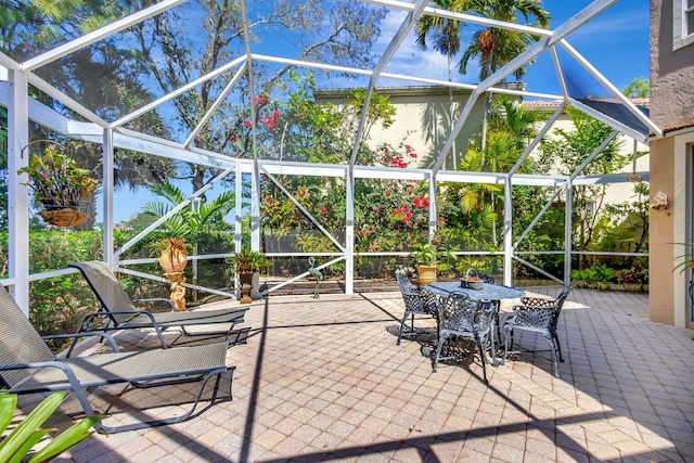 view of patio / terrace with glass enclosure