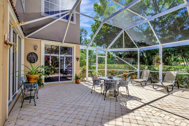 view of patio with a lanai