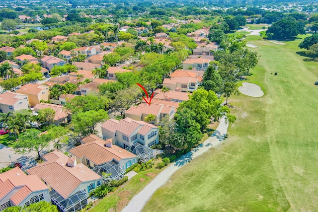 aerial view with golf course view and a residential view