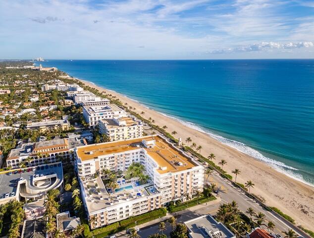 aerial view with a view of city, a water view, and a view of the beach