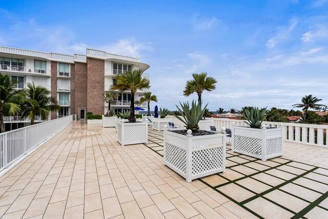 view of patio featuring fence