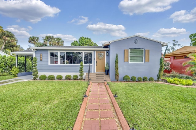 ranch-style house featuring a front lawn and stucco siding