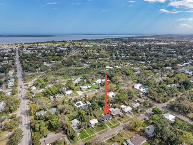 birds eye view of property featuring a water view and a residential view