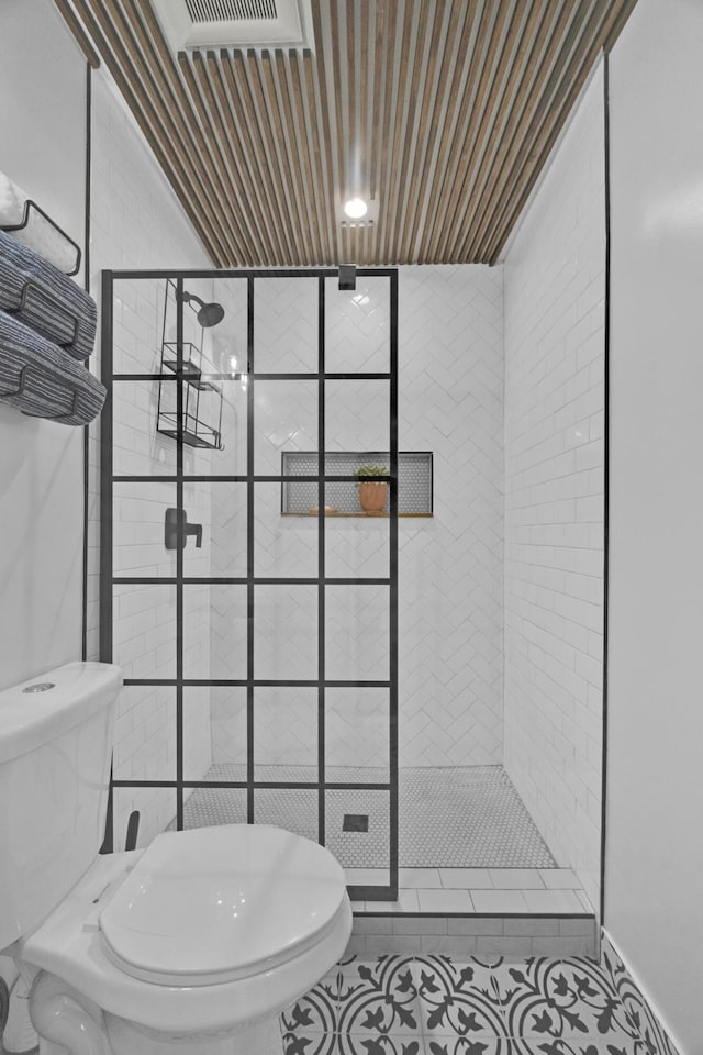806 S 12th St, Fort Pierce, FL 34950 - full bathroom featuring a stall shower, tile patterned flooring, and toilet