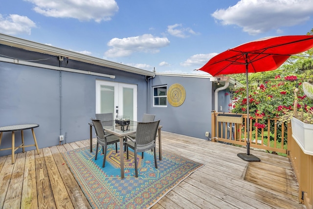 806 S 12th St, Fort Pierce, FL 34950 - wooden terrace with french doors and outdoor dining area
