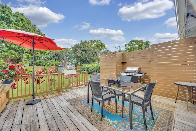 806 S 12th St, Fort Pierce, FL 34950 - wooden deck featuring outdoor dining area, area for grilling, and fence