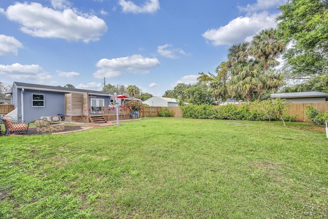 806 S 12th St, Fort Pierce, FL 34950 - view of yard featuring a fenced backyard and a deck