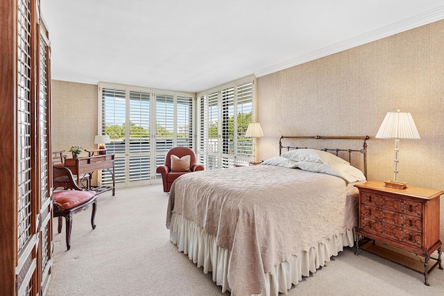 bedroom featuring light carpet, access to exterior, crown molding, and wallpapered walls