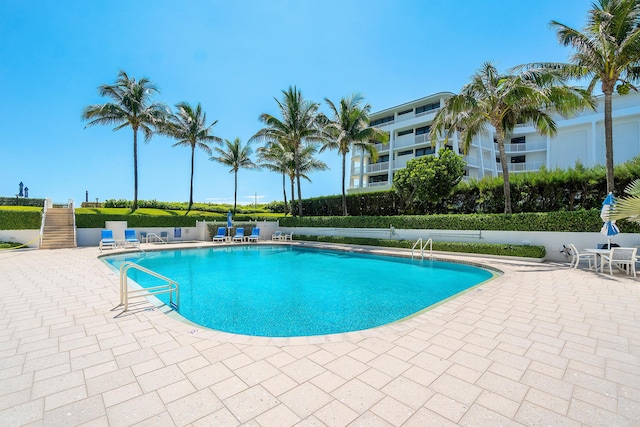 community pool with a patio