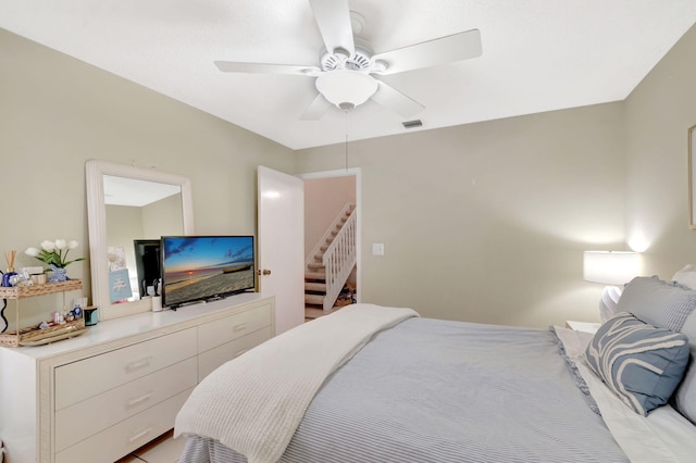 bedroom featuring ceiling fan and visible vents