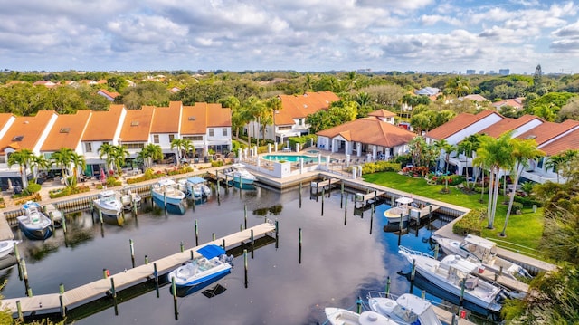 birds eye view of property featuring a water view and a residential view