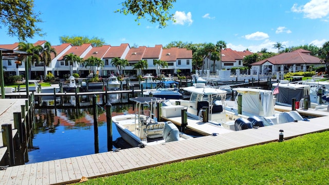 dock area with a water view and a residential view