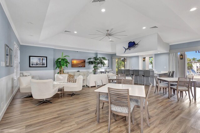 dining space with recessed lighting, visible vents, light wood finished floors, and ornamental molding