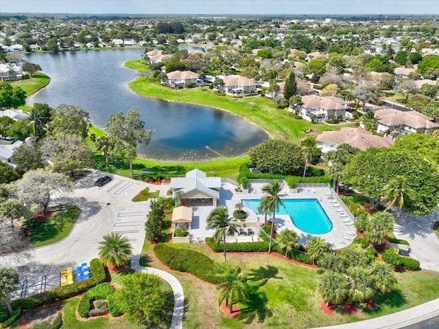 drone / aerial view featuring a water view and a residential view