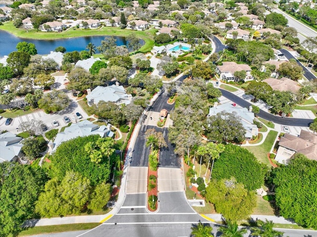 drone / aerial view with a residential view and a water view