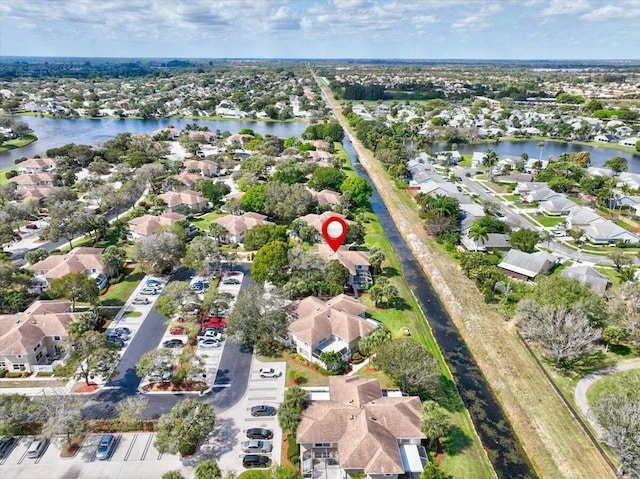 aerial view featuring a water view and a residential view