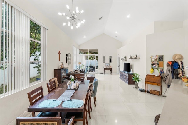 dining area featuring high vaulted ceiling, a wealth of natural light, visible vents, and a notable chandelier