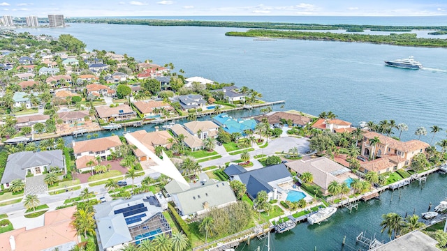 birds eye view of property featuring a water view and a residential view