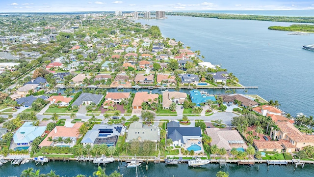 drone / aerial view with a water view and a residential view