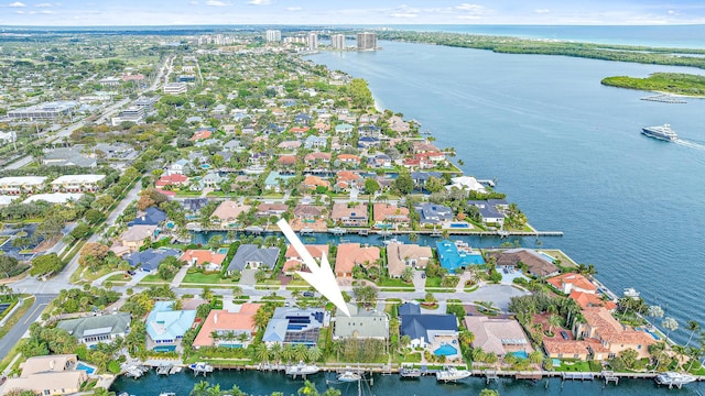 bird's eye view featuring a water view and a residential view