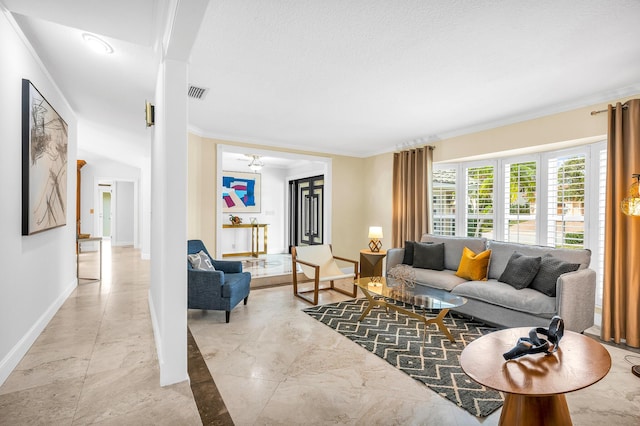 living area featuring a textured ceiling, visible vents, baseboards, marble finish floor, and crown molding