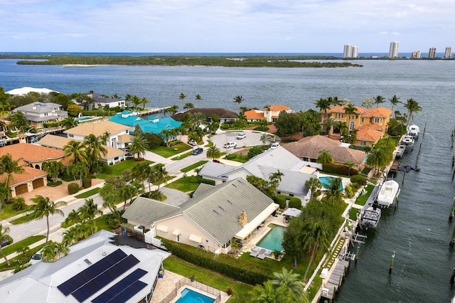 birds eye view of property featuring a residential view and a water view