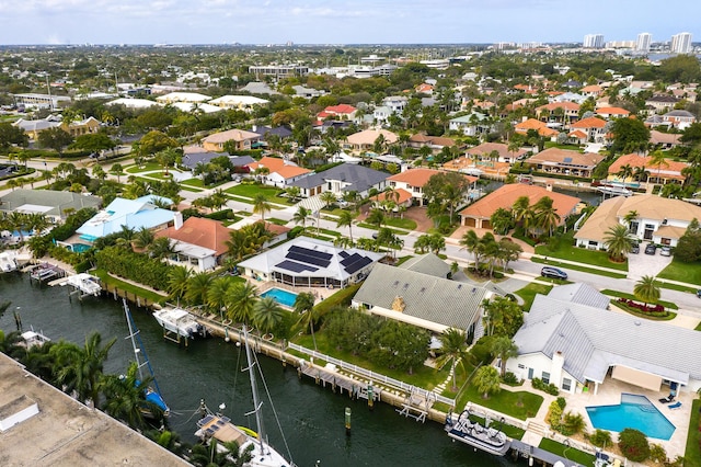 aerial view featuring a residential view and a water view